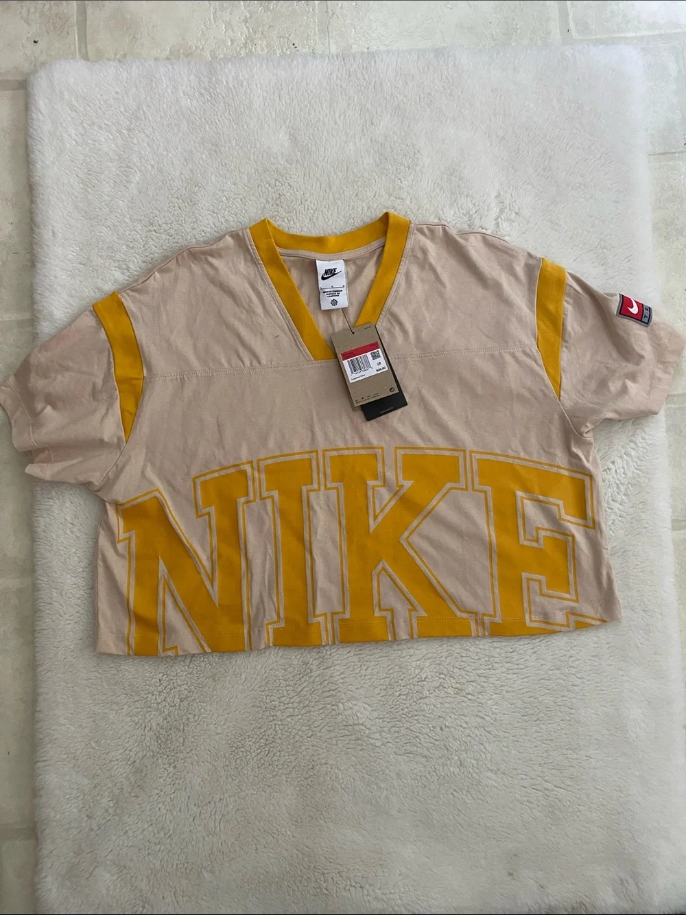 Nike Beige Cropped V-Neck Top with Yellow Logo and Trim